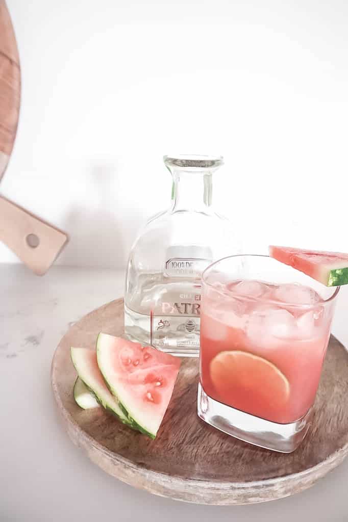 watermelon margarita with tequila and watermelon in the background