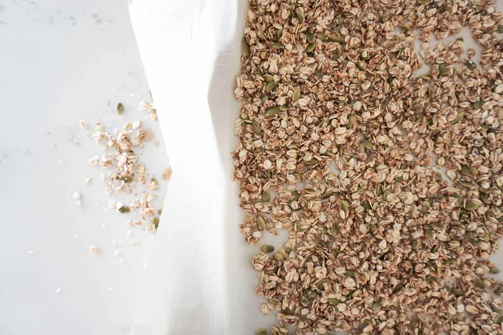 Overhead shot of granola breakfast cooling on a cookie sheet