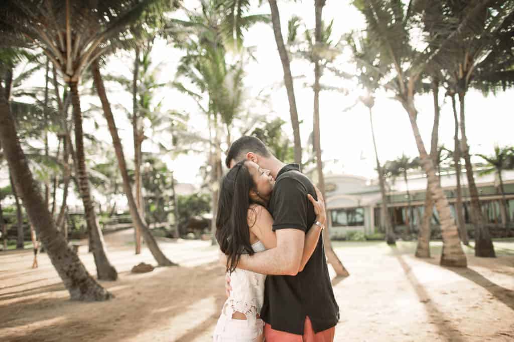 Signed Samantha's talking about what she's learned after three years of marriage while hugging her husband with palm trees in the background