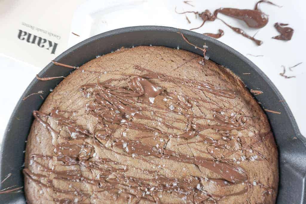 Signed Samantha's Skillet Hazelnut Brownie Blondie Bars pictured with kana parchment paper in the background