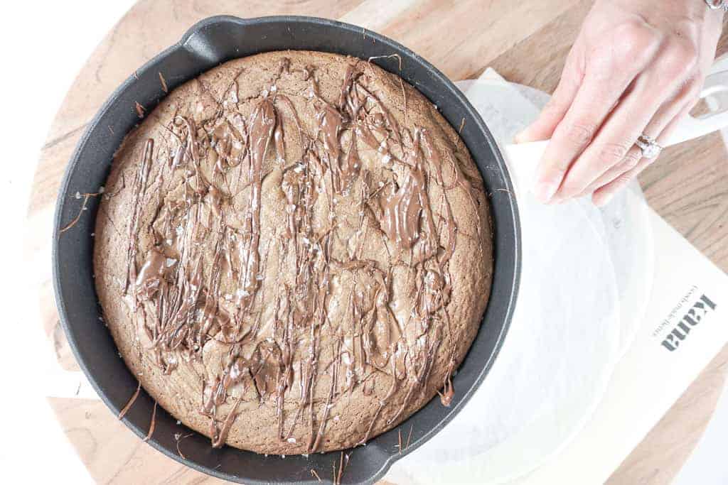 Signed Samantha's Skillet Hazelnut Brownie Blondie Bars pictured fresh out of the even, in the skillet.