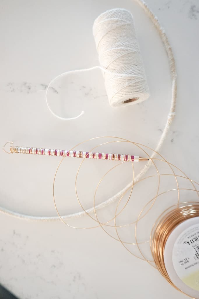 Some of the materials needed for making a D.I.Y Christmas Card Holder are pictured here - including a floral hoop, twine, copper wire.