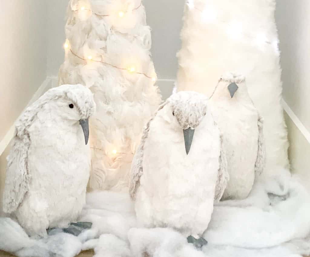 Part 2 of 5 of Signed Samantha's gift guide for The Ultimate 2020 Gift Guide: Friends, Colleagues and Kids. Three penguins "marching" in front of two fur trees