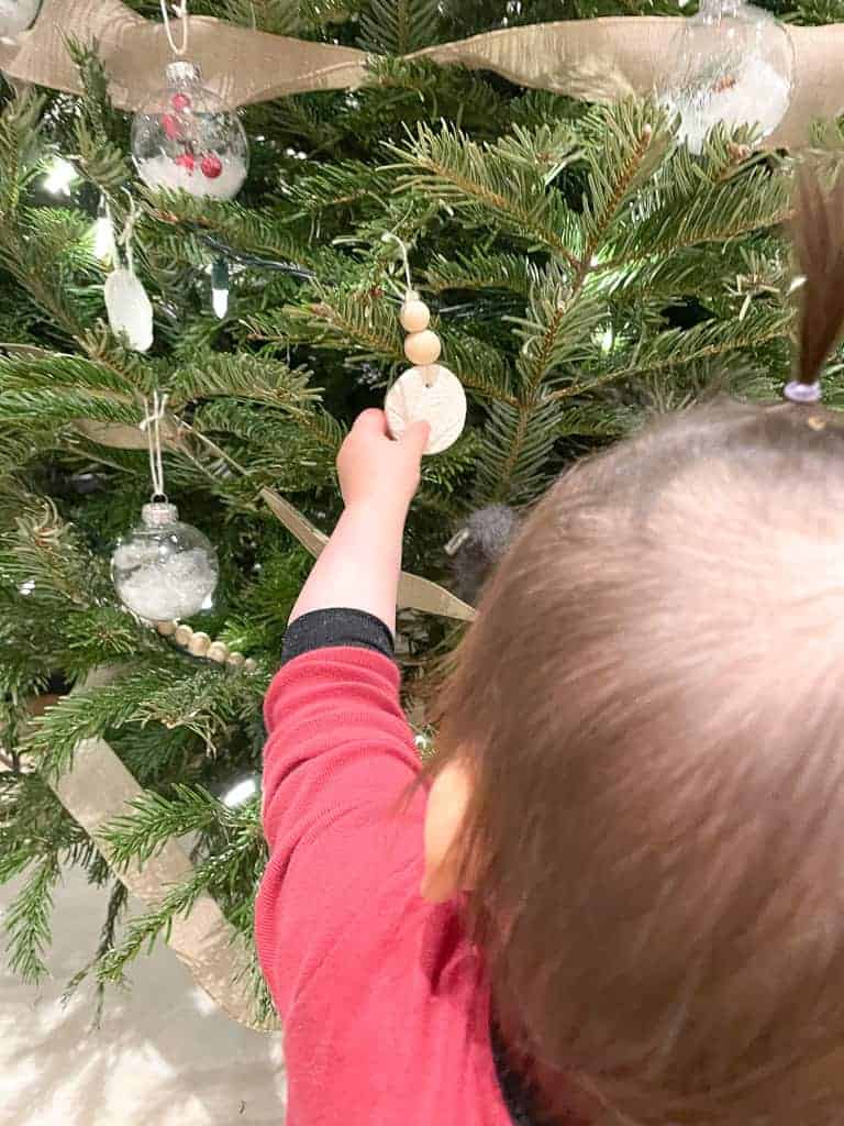 Signed Samantha's daughter reaching for the D.I.Y Clay Ornaments