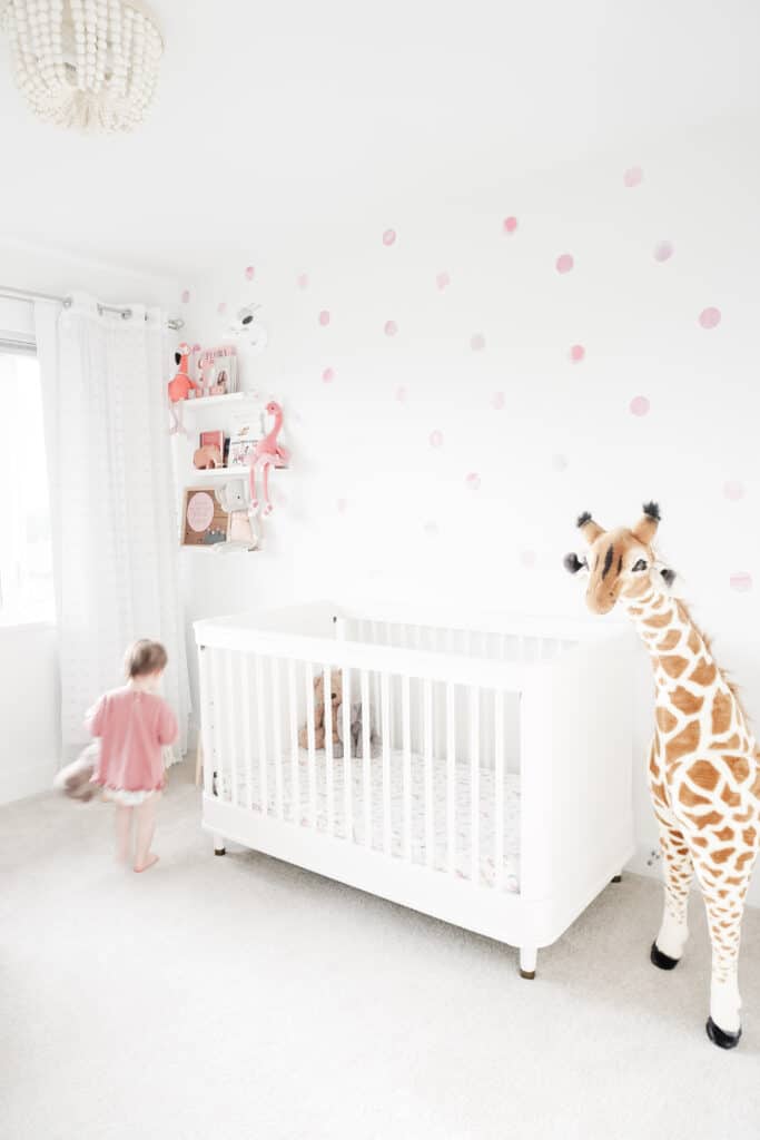 Sloanes Nursery Tour is on Signed Samantha today. You can see Sloane's crib, a huge giraffe, shelves, and Sloane, blurry, running through the screen