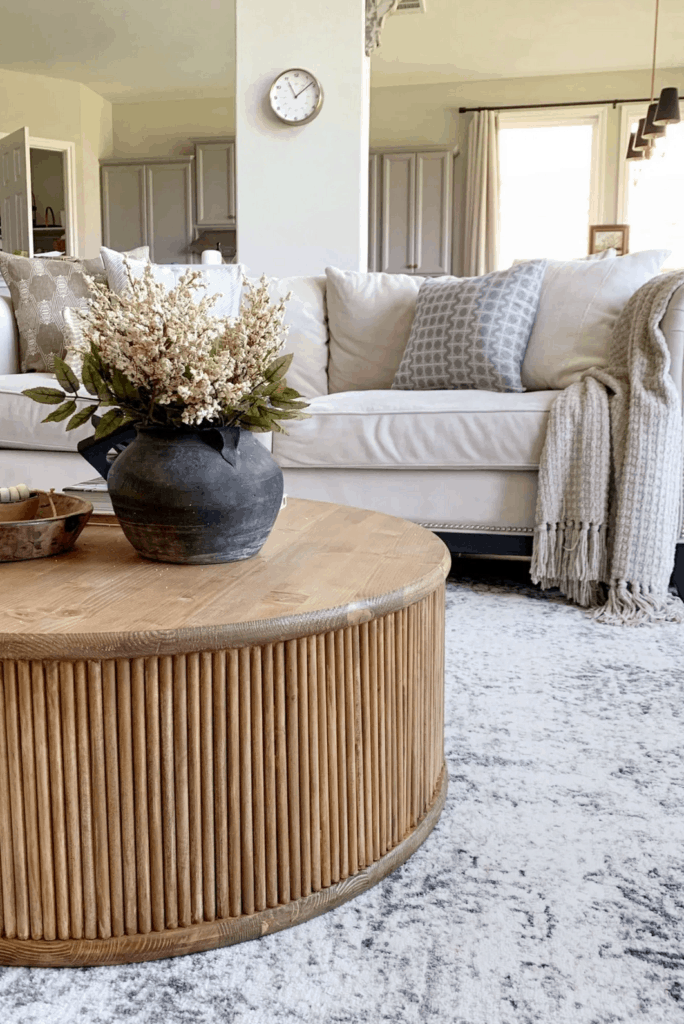 DIY Inspiration - a round dark stained wood DIY gluted coffee table.