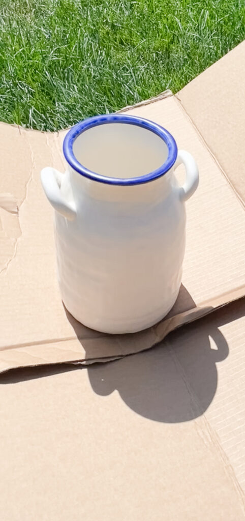 the vase pre- antique vase DIY strategies - it is painted white and blue.