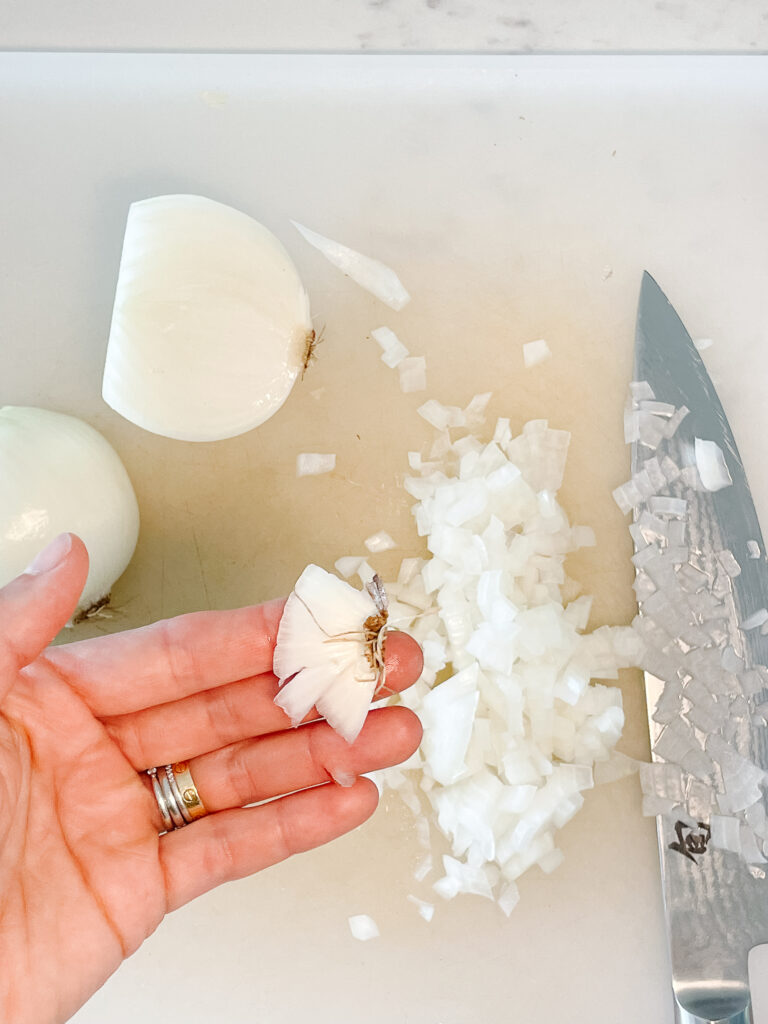 how to cut an onion showing perfectly diced and uniform onions.