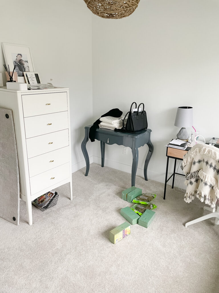 Signed Samantha's Home Office space two desks, a dresser, a bunch of random stuff on the desks and on the ground.