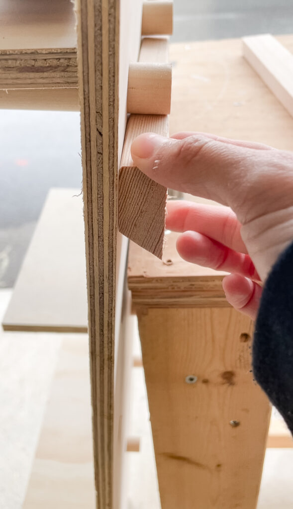 Signed Samantha showing you a french cleat for your DIY pegboard