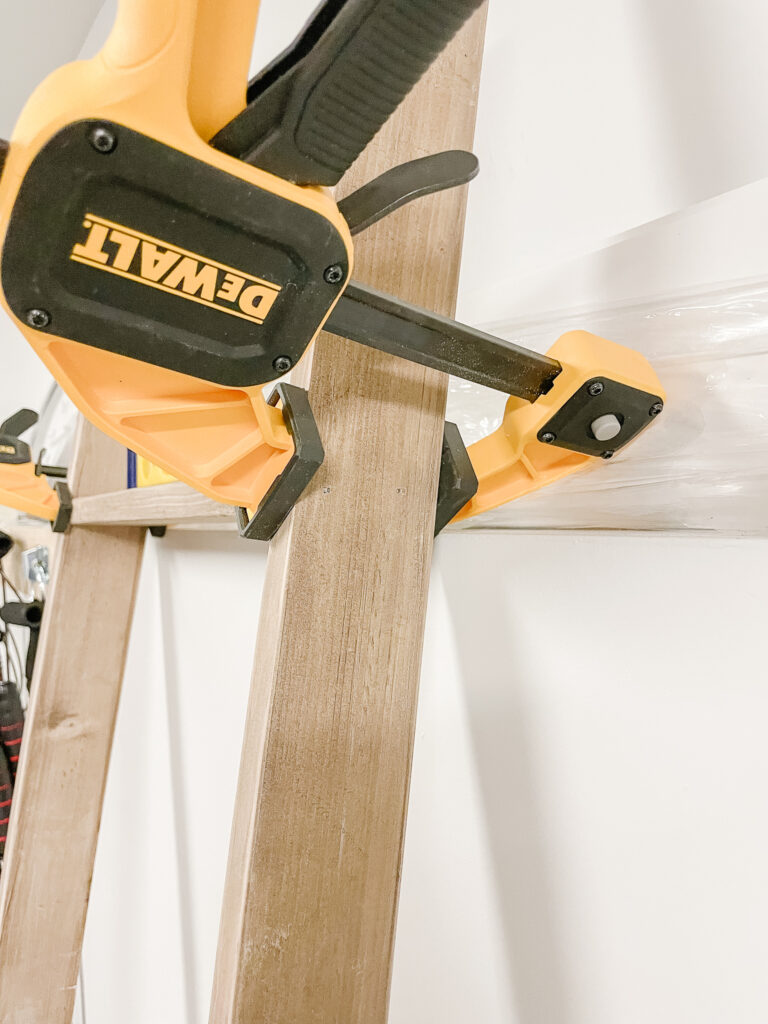 DIY Blanket Ladder in the making -the clamp holding the rungs to the sided.