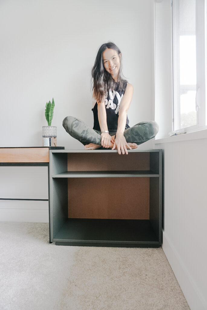 Signed Samantha sitting on her Ikea Ivar box that she has a hack for and is sharing during the one room challenge week three.