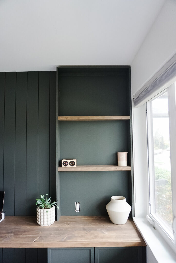 Signed Samantha's built-in bookshelf it is not quite finished. The built-in bookshelf is in green and the shelves are wood