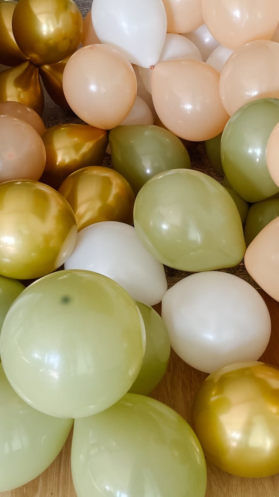 the process of making a DIY balloon garland.