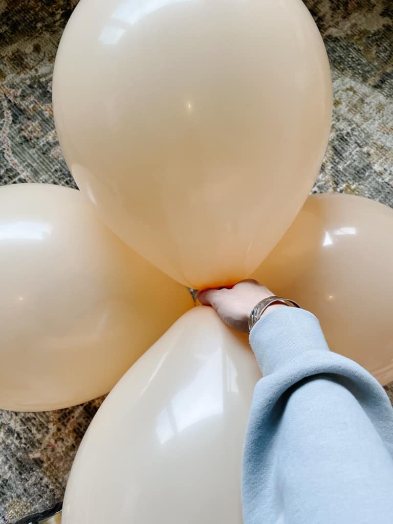 four balloons put together to make part of a balloon garland.