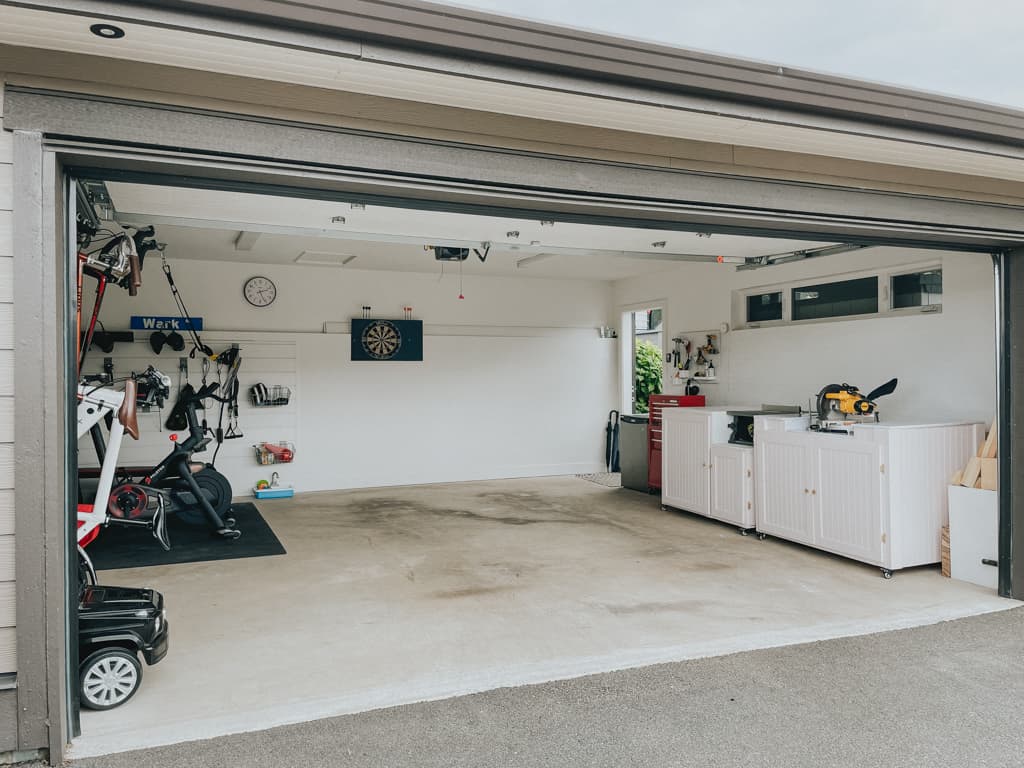 completed garage makeover. garage workshop, garage gym, all in one little garage