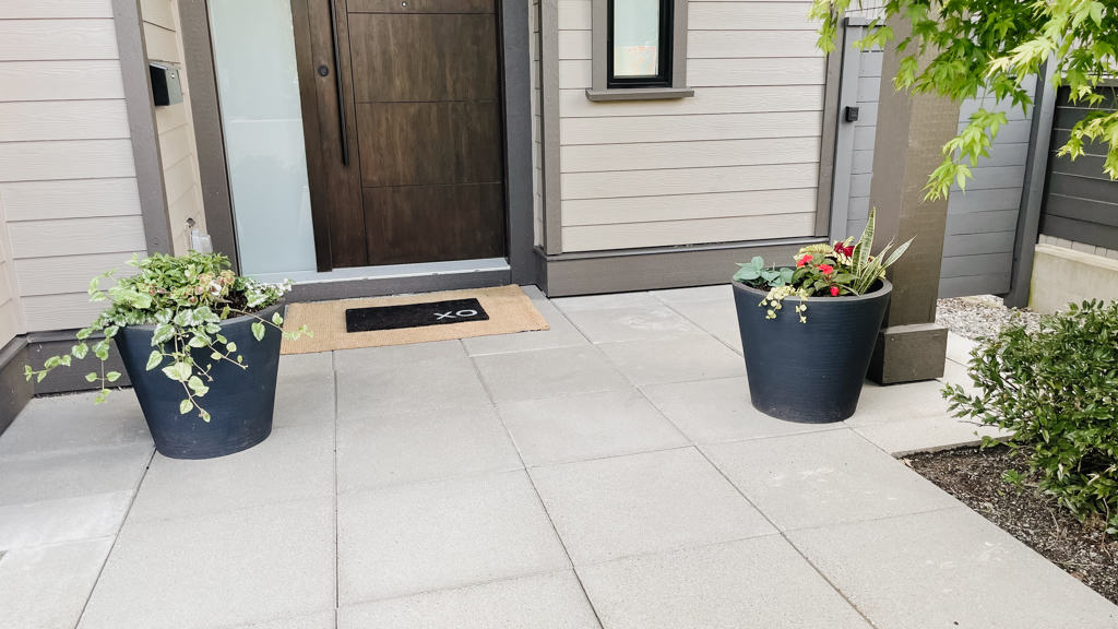 Planting planter baskets in pots two pots in front of a front door