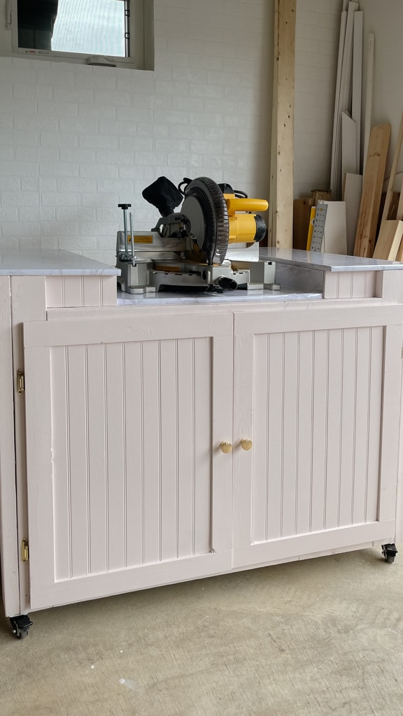 pink garage workbenches with shaker doors - a mitre saw station