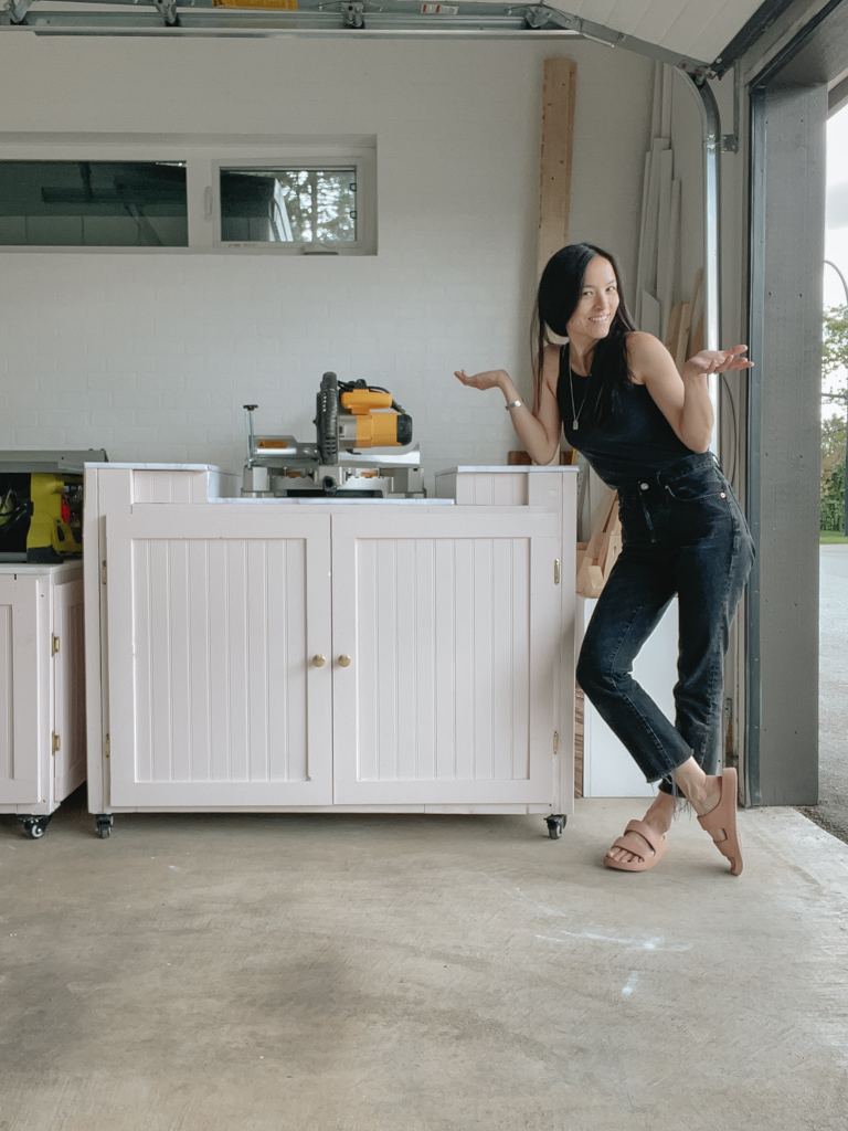 completed mitre saw station with Samantha standing next to it