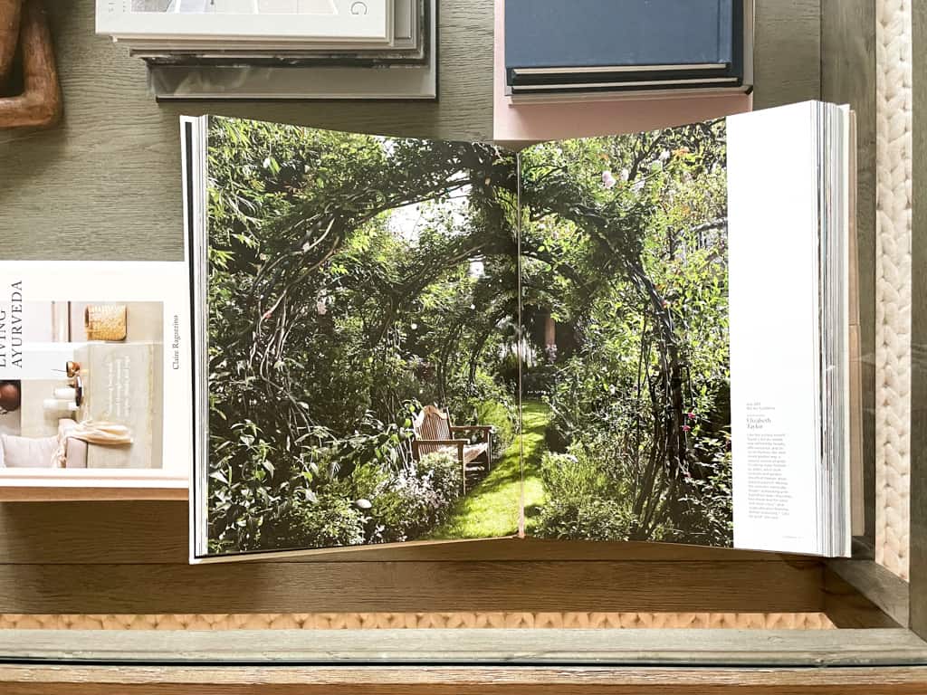 looking through the glass of a coffee table down at a book display