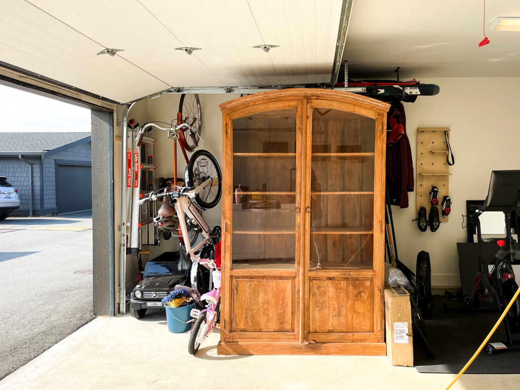 Beautiful arched cabinet that needs to be refinished - glass panels and covered base