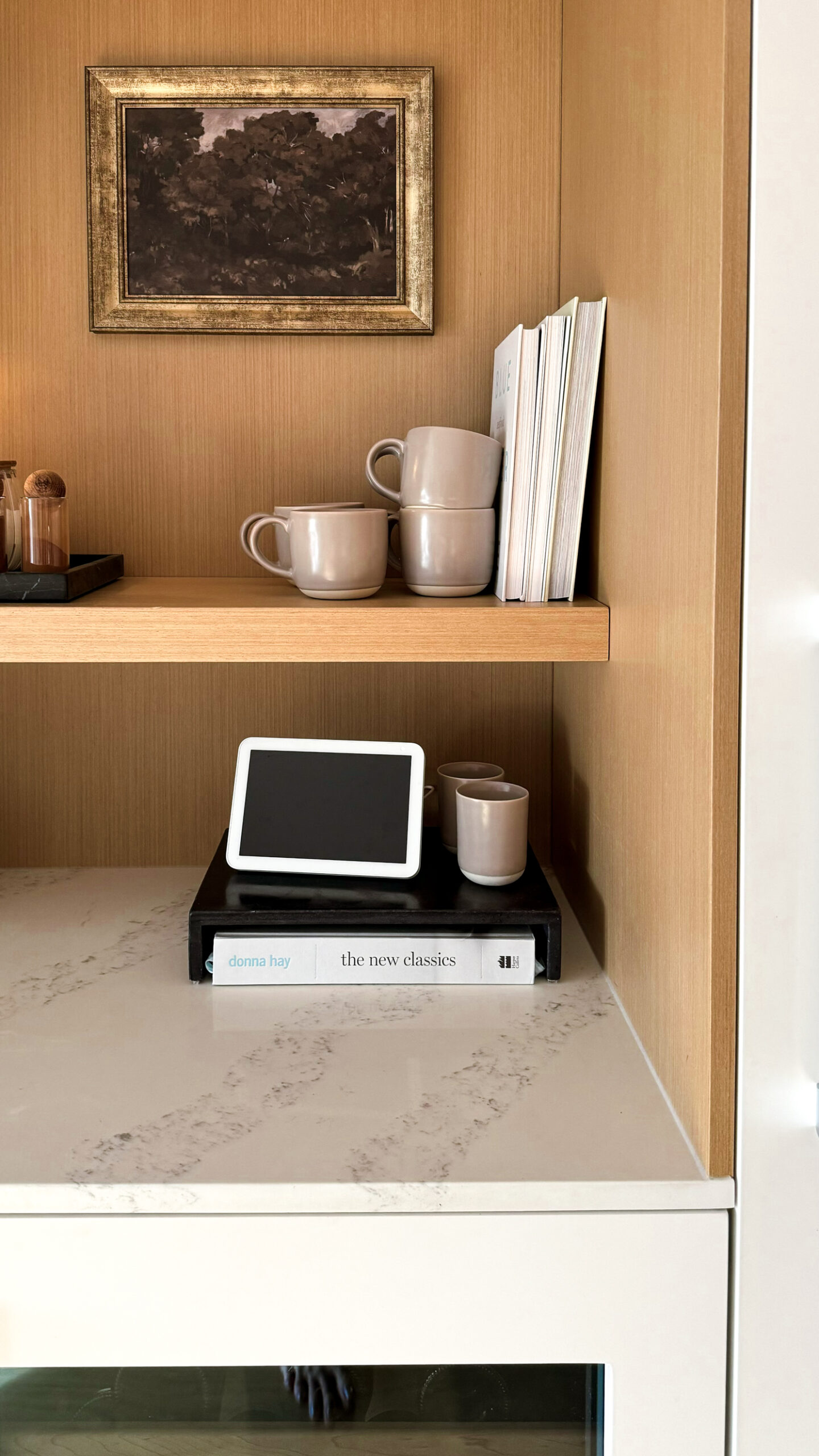 a tea bar decked out with mugs, milk frother and more.