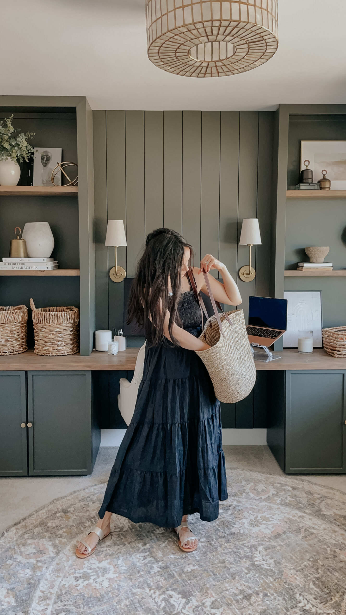 summer must-have's include a summer dress, straw tote, and metalic sandals - such as what the girl in the picture is wearing