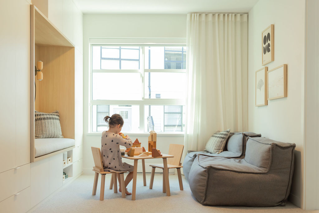 childplaying in the family room of the Eastwoods townhome