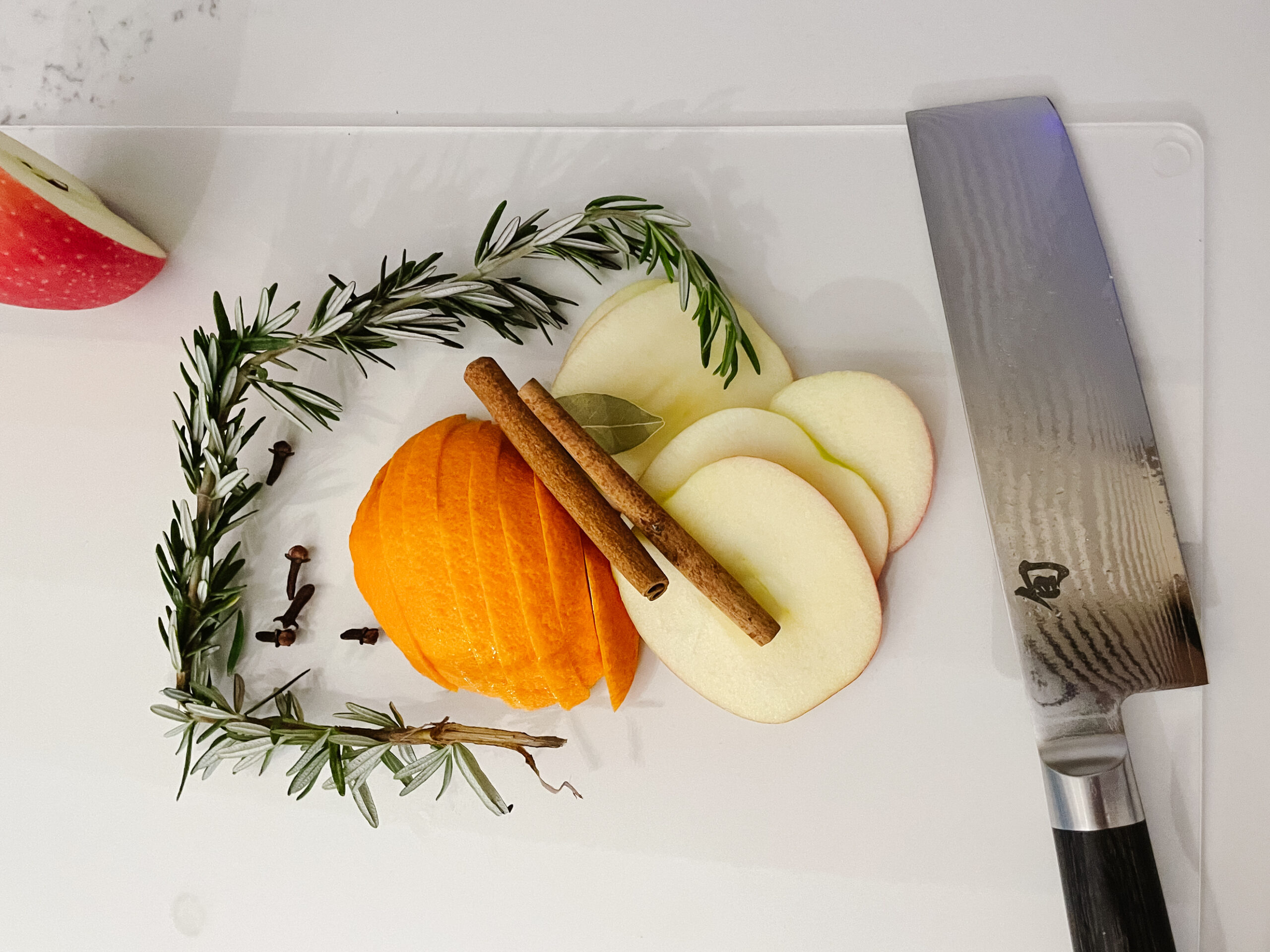 Simmer Pot Ingredients on a clear cutting board