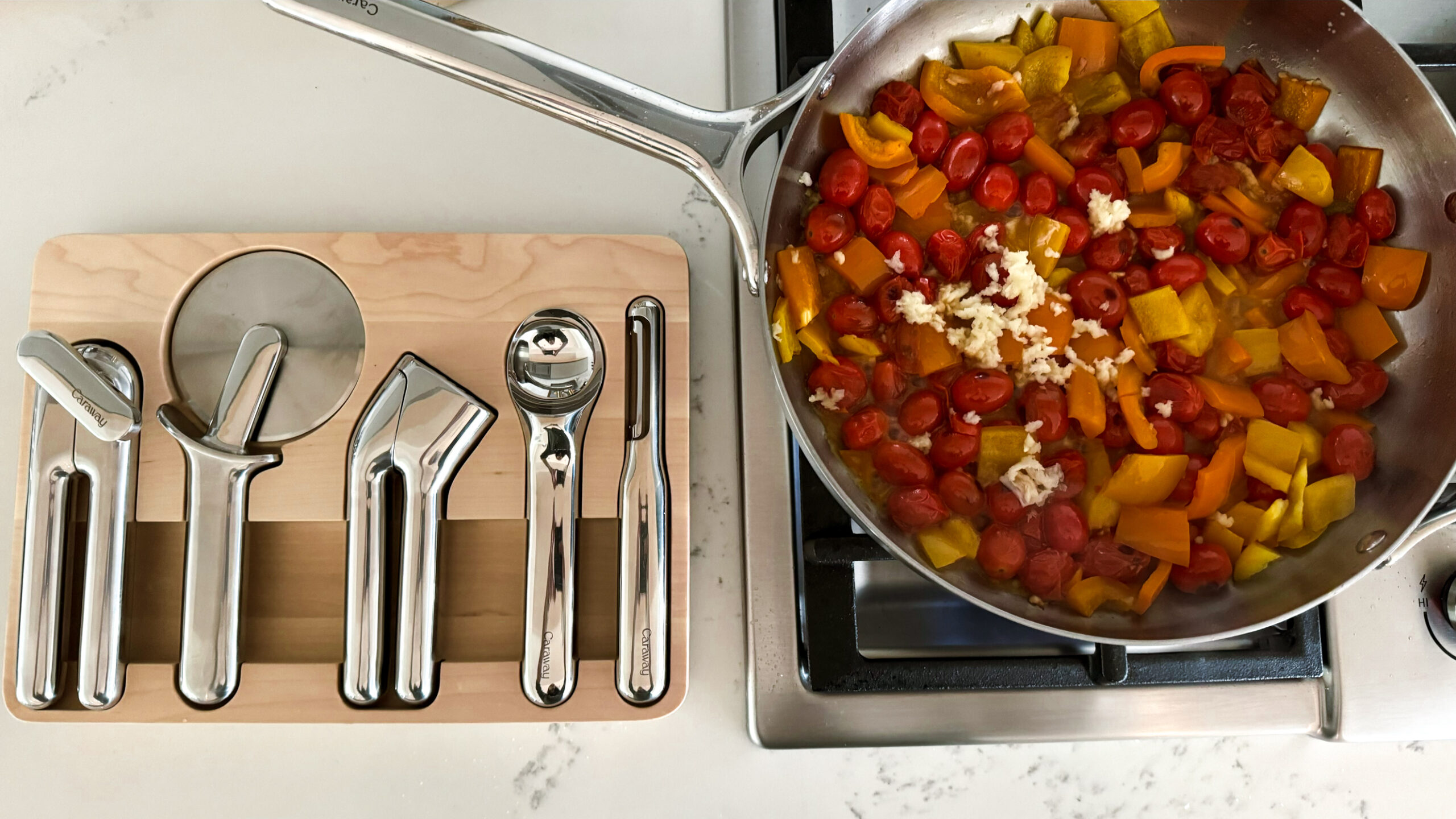 Caraway's stainless steel pan along with their new stainless gadgets