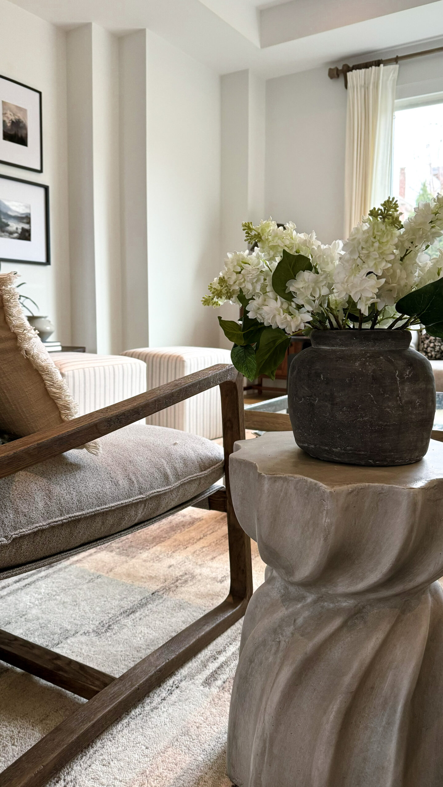 Spring florals in a vase - white lilacs in a living room